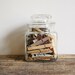 Vintage apothecary jar of clothespins