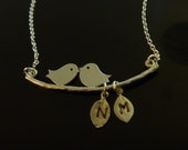 Kissing Birds on a Branch with Two Stamped Leaf Initial