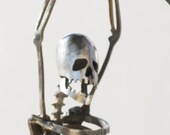 Zombie Skeleton Hanging On for Life Metal Sculpture