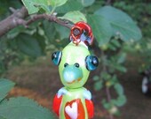 Handmade SRA colorful tropical bird lampwork bead in green and orange