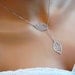 Delicate Leaf Lariat Necklace in Silver- spring to fall, modern, simple everyday elegant style, available in gold.