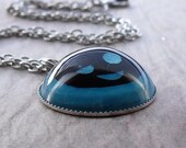 Wrinkled wink smiley face resin necklace