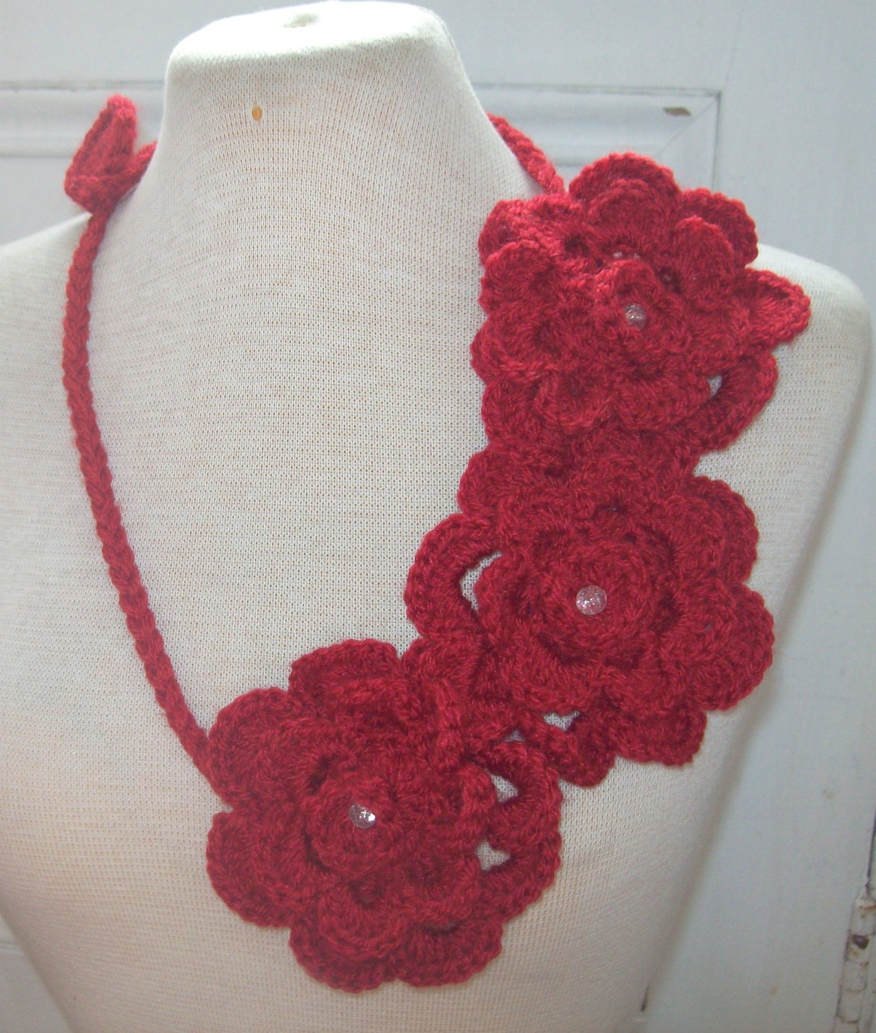Red crochet necklace with three flowers