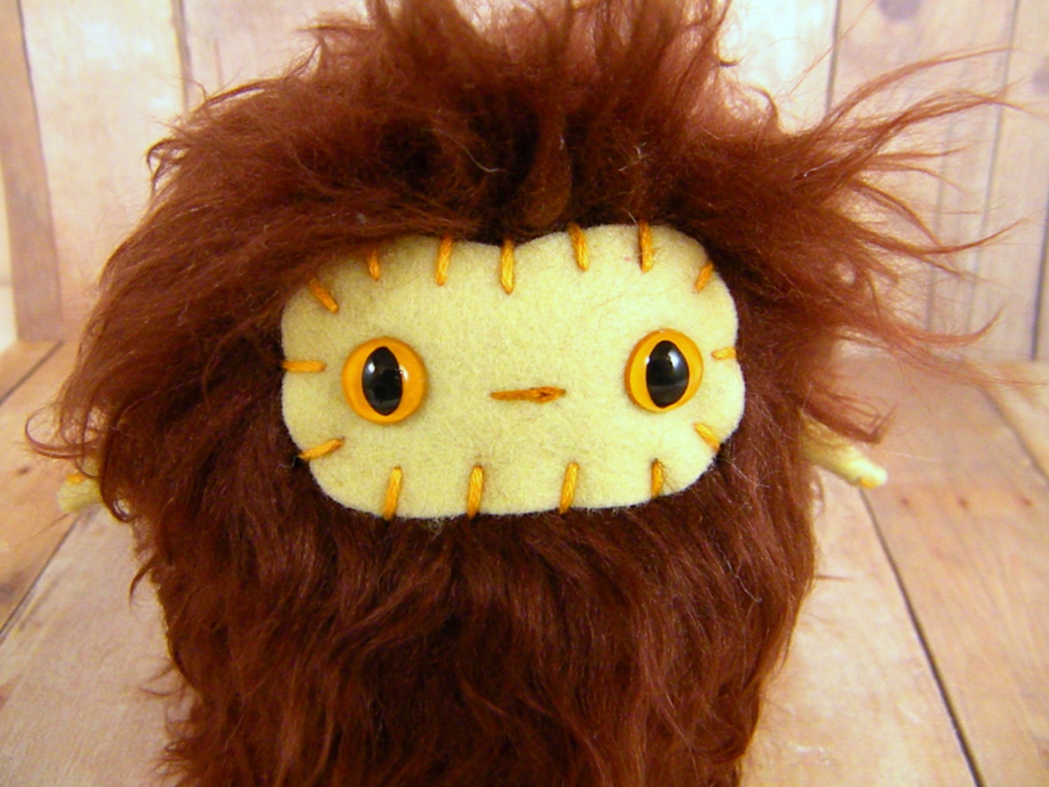 Floyd the plush monster miniature burnt brown and pastel yellow stuffed animal