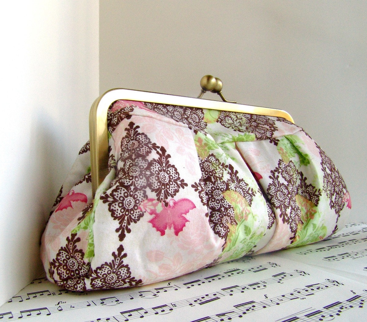 Blush pink, brown, and green framed clutch with butterflies, spring fashion