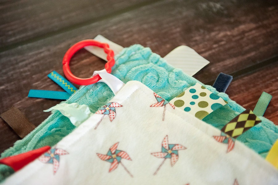 pinwheel TAG RIBBON blanket for baby - sensory blanket toy - featuring flannel minky fabric.