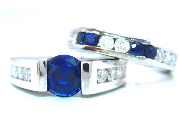 Round sapphire and diamond tension set engagement ring and band