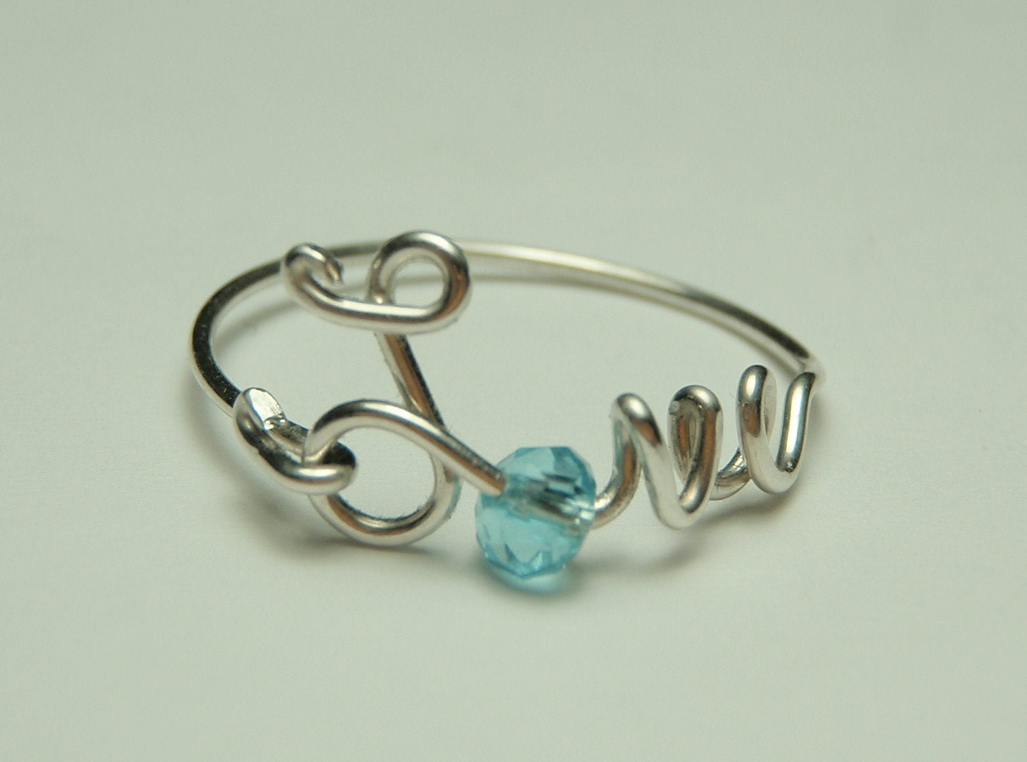 love wire ring sterling silver - baby blue faceted crystal reduced price-love word- script-italics-writing