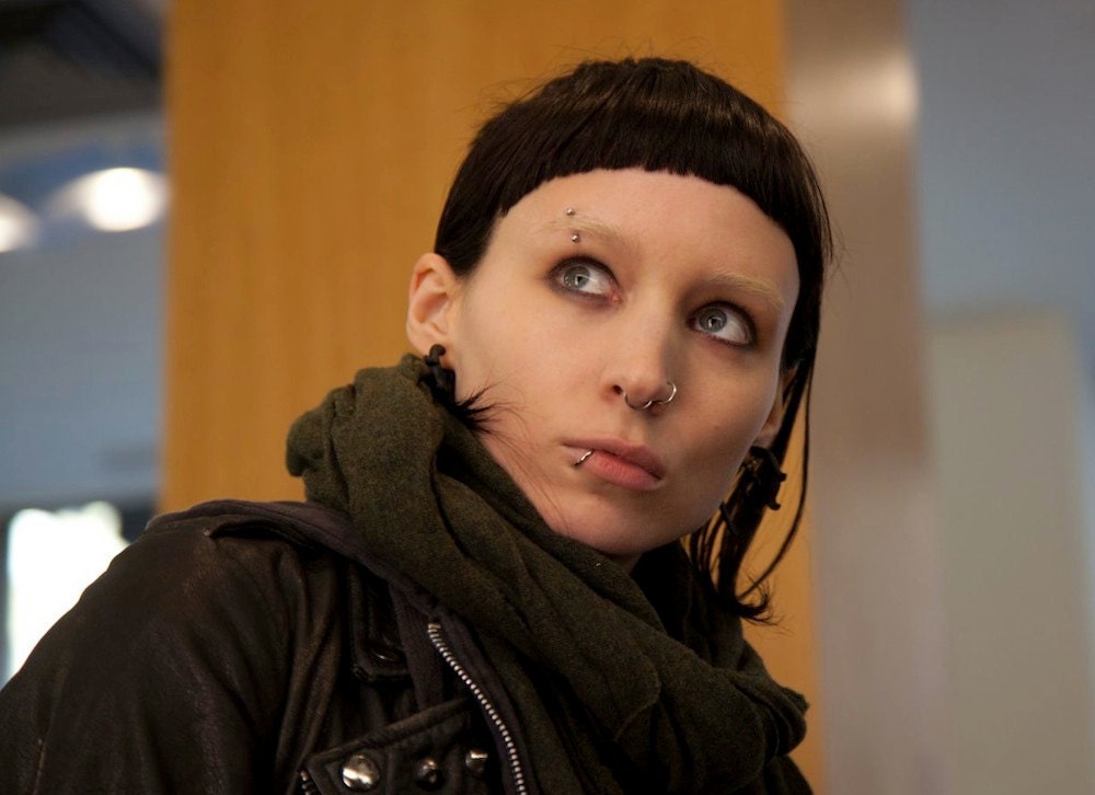 girl with dragon tattoo horn tribal earrings