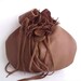 leather wristlet in light brown with detachable flower,hat pin or brooch by Tuscada. Ready to ship.