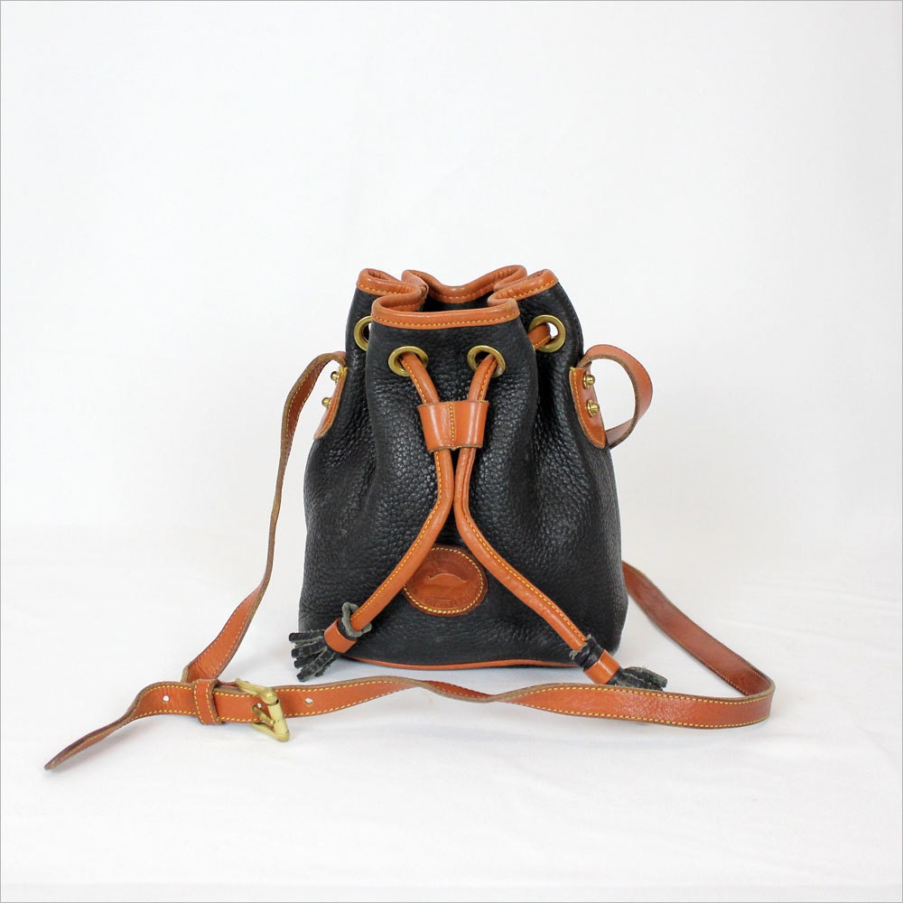 HOLD Dooney and Bourke AWL bucket bag / small cross body navy blue & brown leather