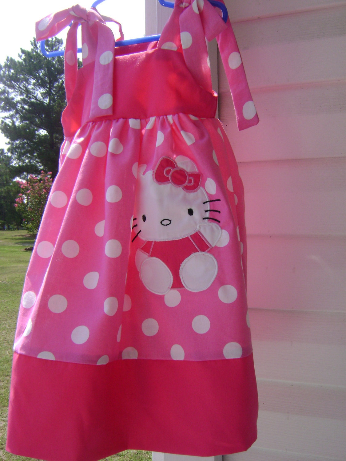 Dress with the kitty sizes 6 months up to size 10