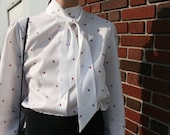 White blouse with red flower pattern