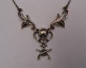 Sterling Silver Skull with Hanging Crossed Guns and Side Florentine Designs Necklace