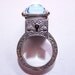 Locking Poison Ring with Key on Chain in Sterling Silver with Topaz and Sapphires