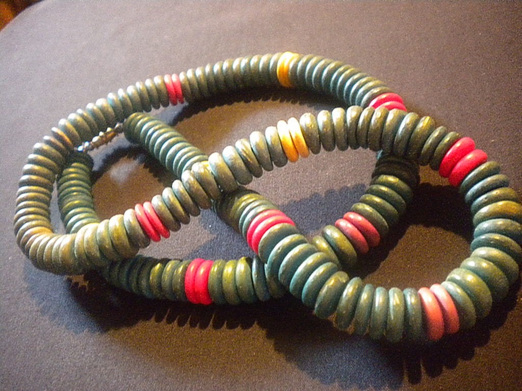 Vintage wooden bead necklace is colorful turquoise blue, yellow, red, purple and magenta red