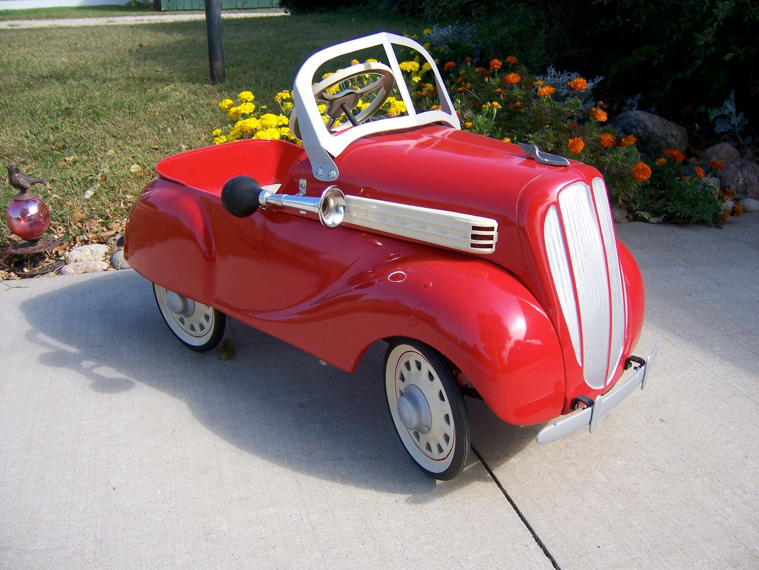 Vintage pedal car from mid to late 1930s in dazzling red now for sale. Original antique beautifully restored.