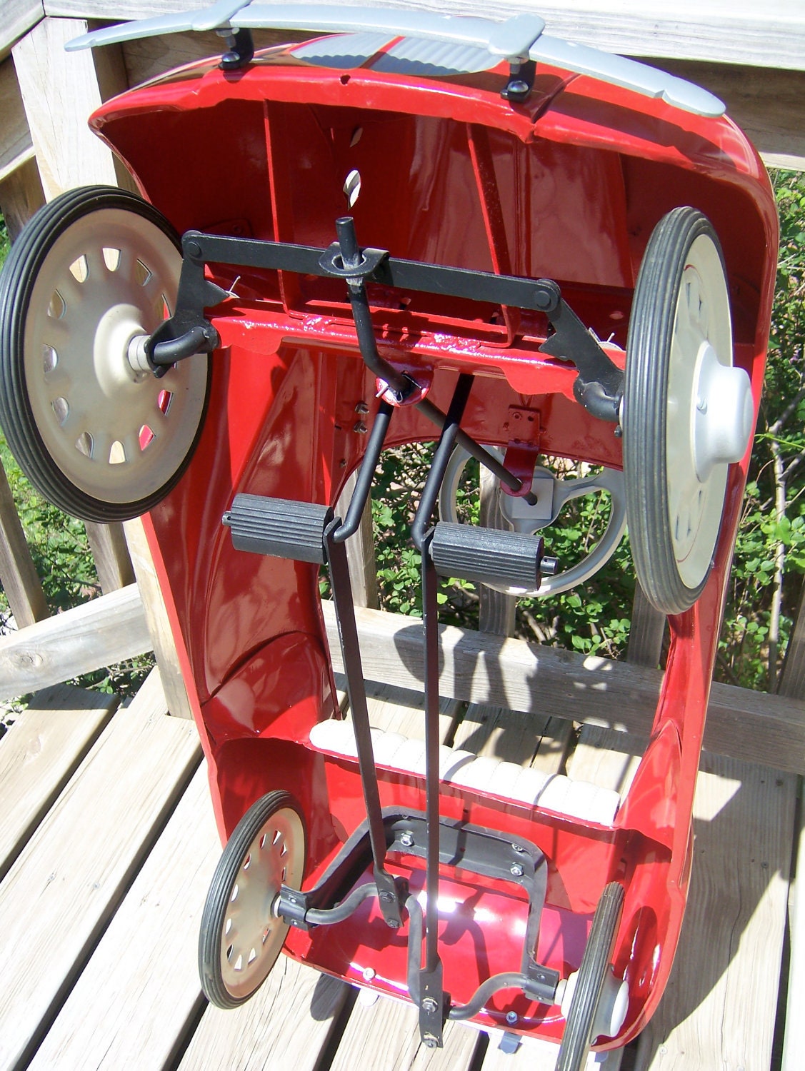 Vintage pedal car from mid to late 1930s in dazzling red now for sale. Original antique beautifully restored.