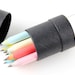 9 Piece Colorful Eco-Friendly Recycled Paper Pencils in black kraft tube - made from 100% recycled paper - great as gifts and party favors