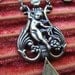 Antique cherub religious necklace paste crystal bezel repousse sterling tassel one of a kind jewelry assemblage