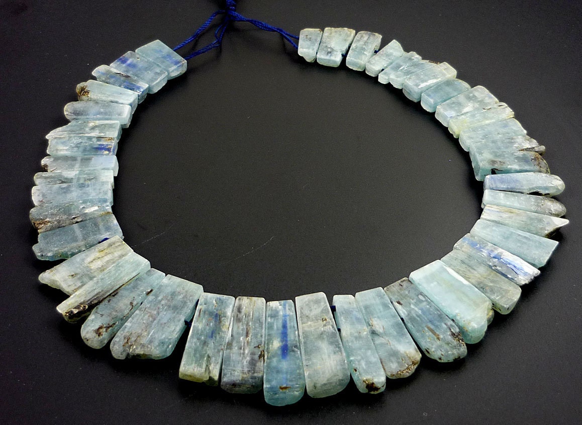 Amazing rough kyanite double drilled plates 15-30mm 1/2 strand
