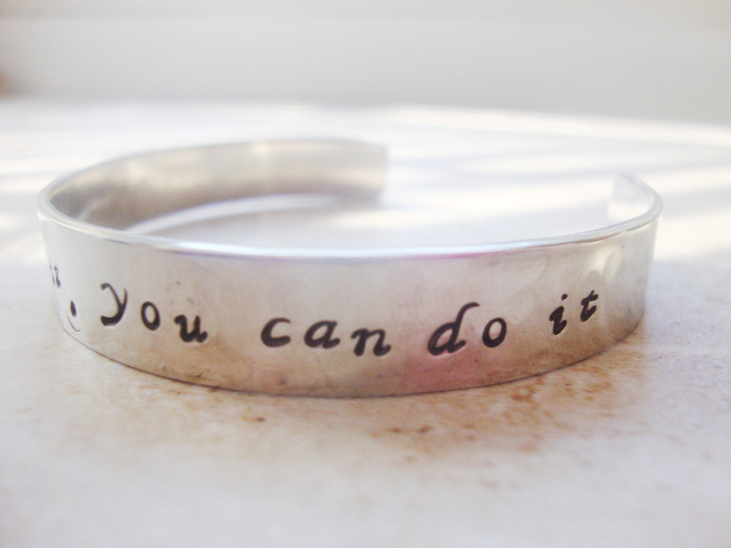 Walt Disney quote hand stamped on a silver hammered bangle cuff