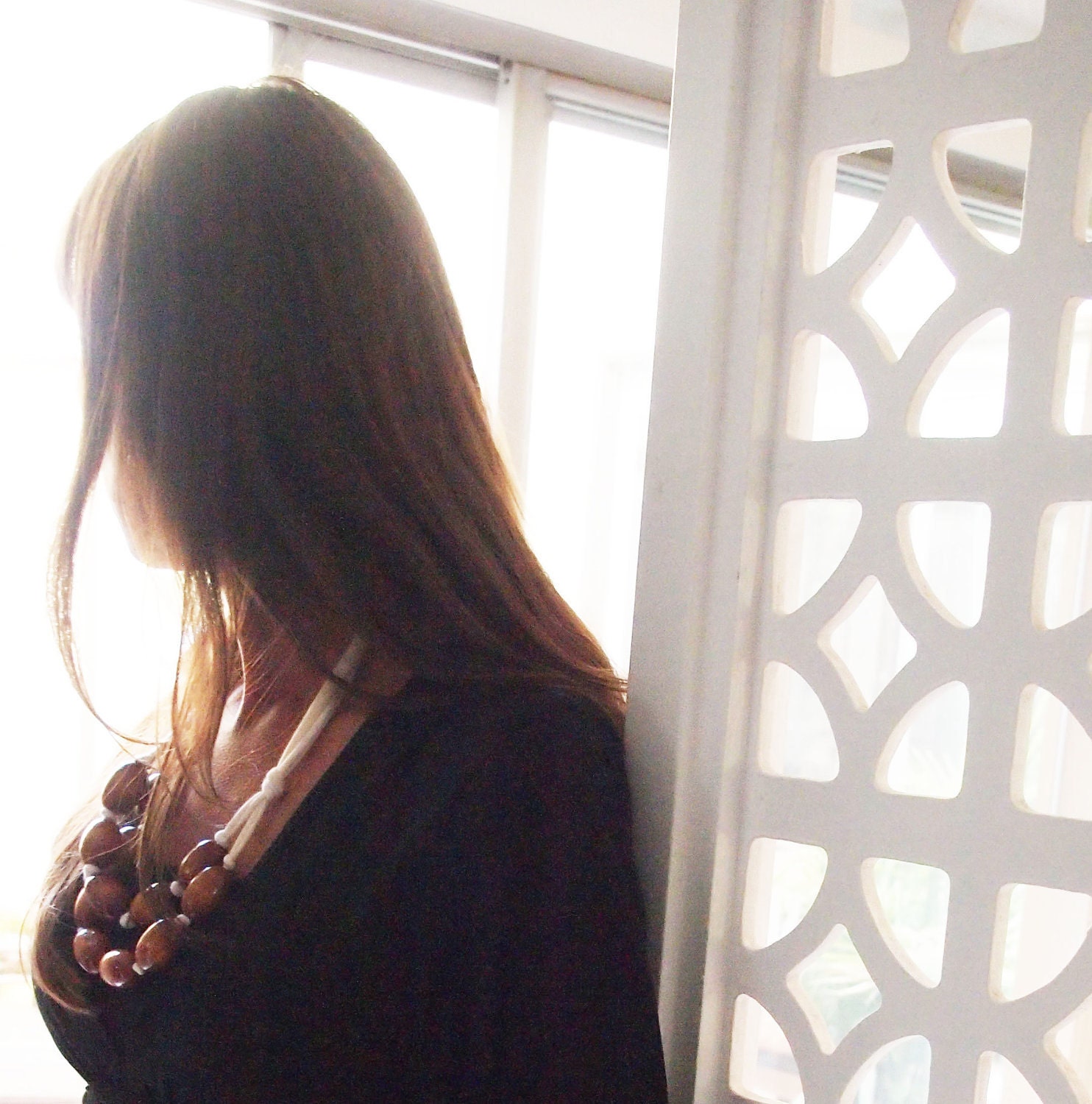 brown wooden bib necklace with cream jersey tie