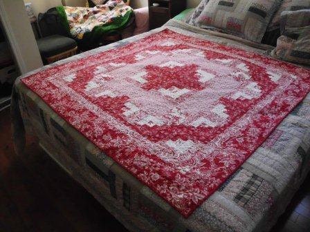 Red and white log cabin quilt