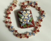 Garnet and Sapphire Necklace with a Hand Painted Carnelian Frower Pendant in Gold
