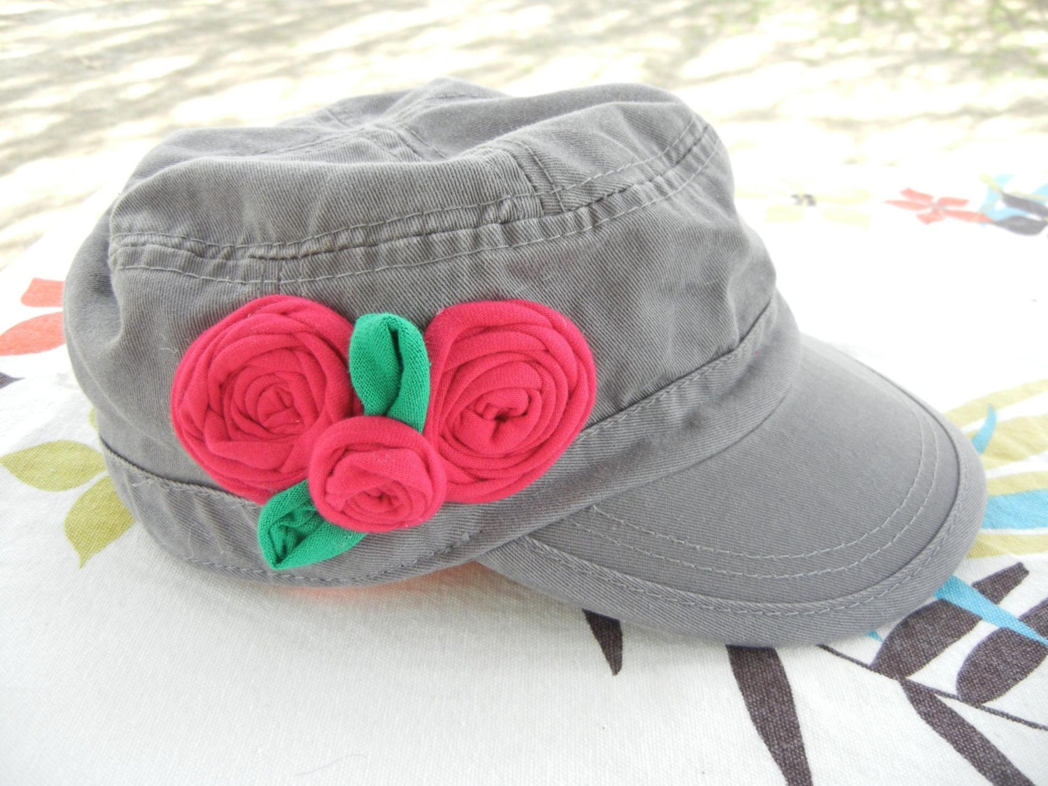 Grey military cap with fabric roses