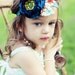Teal Blue & Avocado Green Silky Satin Fabric Flower with Patterned Leaves on a Soft Stretchy Headband