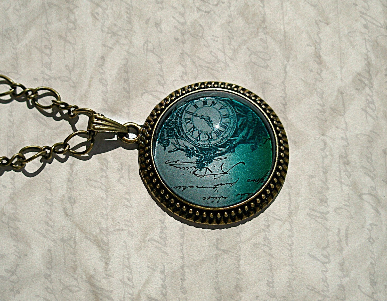 A letter Lost In Time, Bronze Plated Drop Cabochon Setting on a Chain
