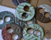 mixed set of five textured 2 inch buttons