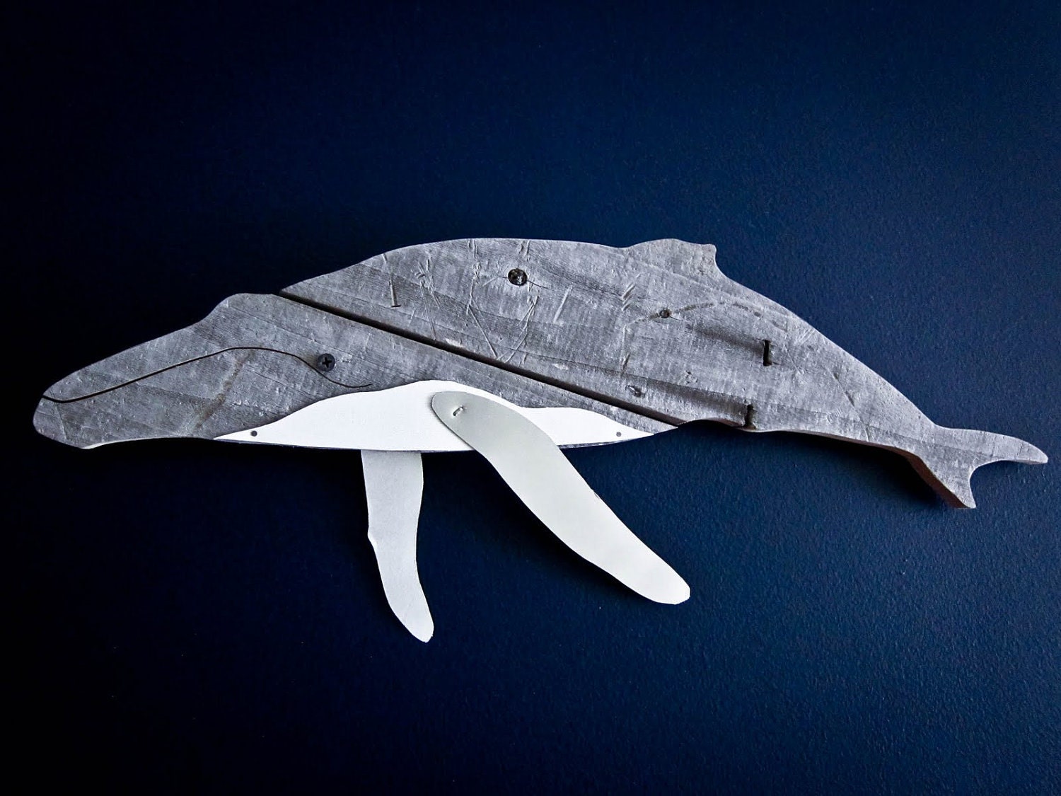 Humpback whale made of recycled wood.
