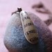 Beach Stone Pendant with Uncial Calligraphy from Book of Kells -- Handmade in Ireland