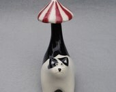 black and white cat with parasol tail, ceramic sculpture