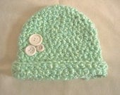 Green newborn hat with buttons