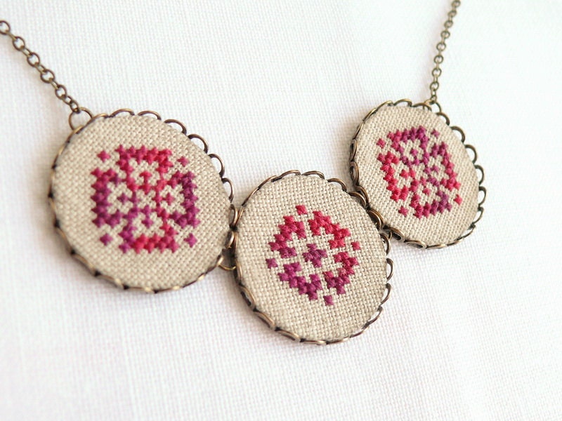 Cross stitch necklace with three ombre red ornament in bronze