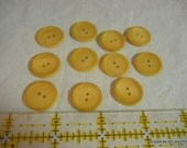 Buttons  11 beige, yellow two hole buttons 3/4 inch