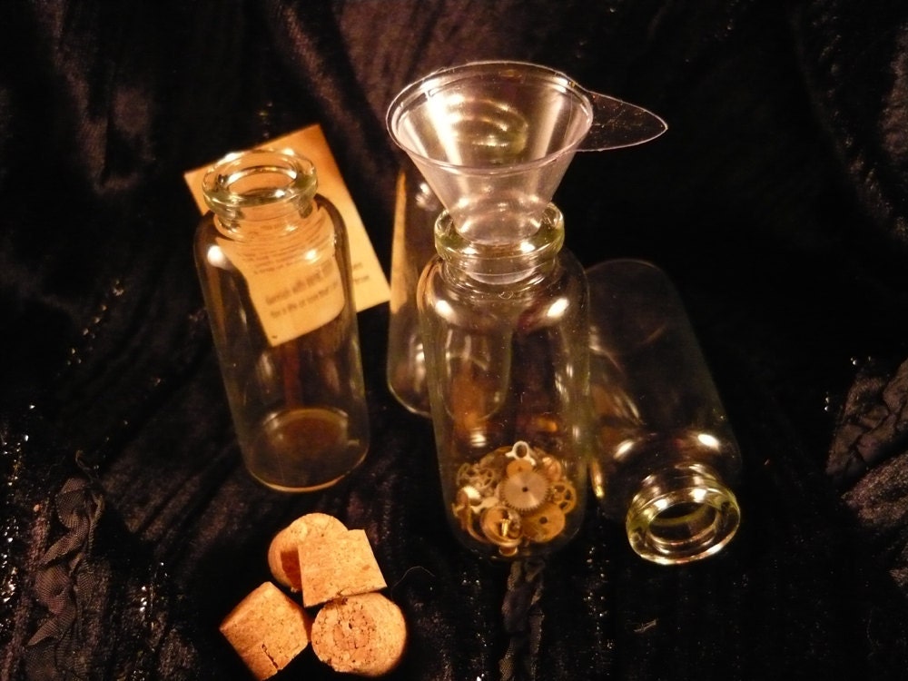 Glass bottles Qty 4, small 2 1/2 inches tall 1 inch wide 3/4 on the opening