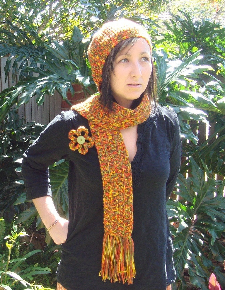 Retro looking crocheted hat, scarf and brooch set