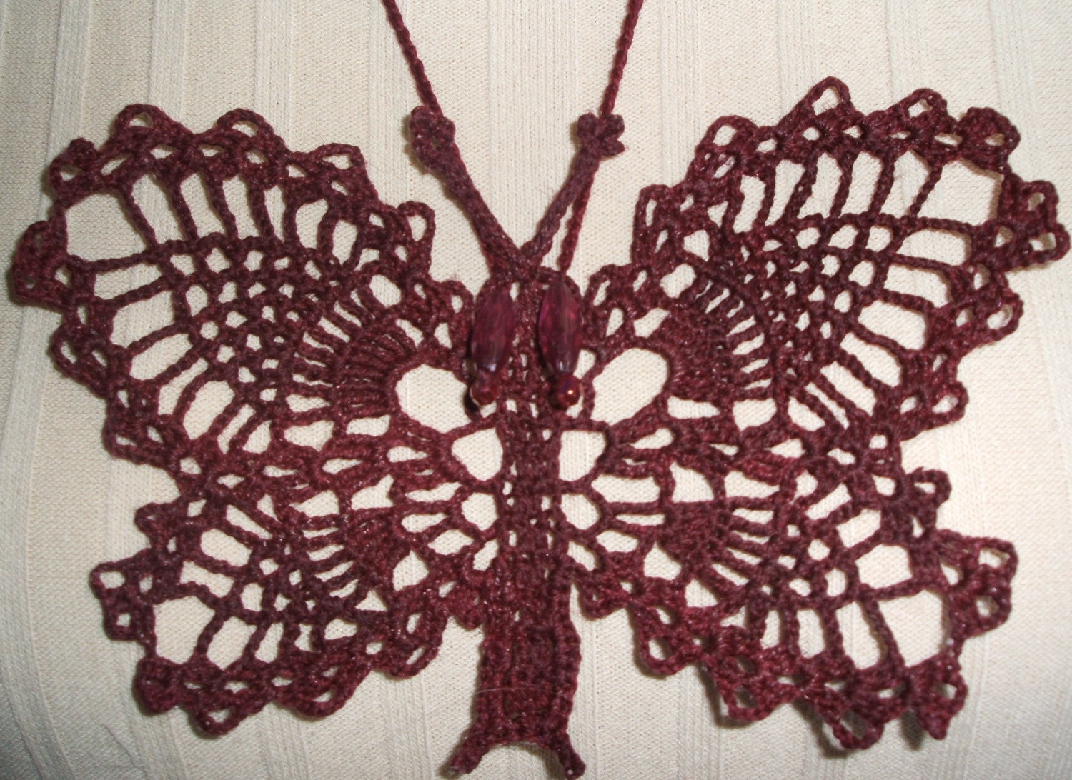 Butterfly burgundy crochet necklace.