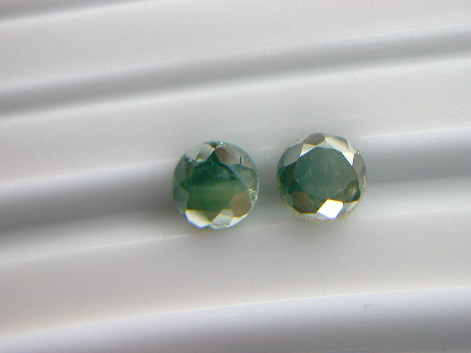 BLUE/Green DIAMONDS. 2 Pieces. matched pair. Conflict Free. 2 pieces. Round Brilliant Cut. Very Sparkly. 0.39 ctw. (DIA93)