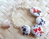 Chain bracelet with fabric buttons and fortune locket