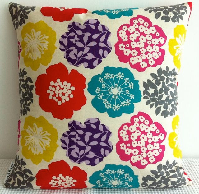 Japanese fabric cushion cover in natural background with colorful floral motif, throw pillow, decorative cushion