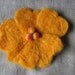 Felted flower hairclip golden yellow