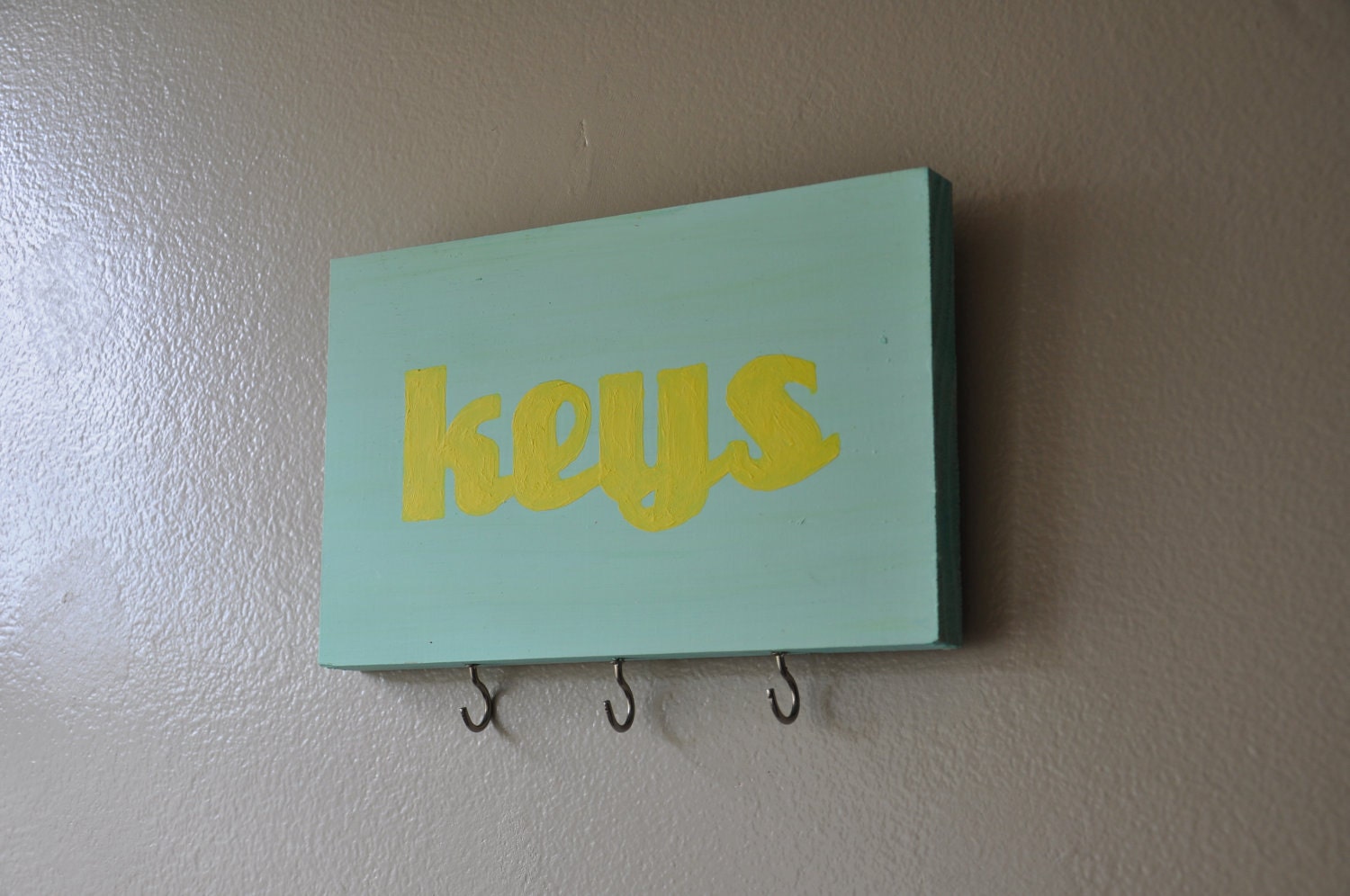 handmade key rack, yellow on turquoise