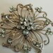 Vintage brooch, Art Nouveau look, large, light green crystals,flower,scrollwork,1950s