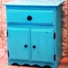 Turquoise Stained Storage Cabinet / TV Stand with Blacks Accents