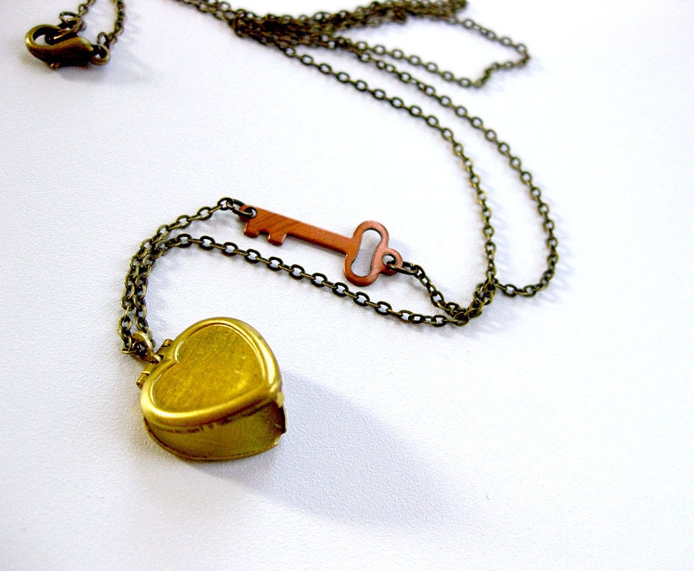 brass heart locket necklace with copper key detail
